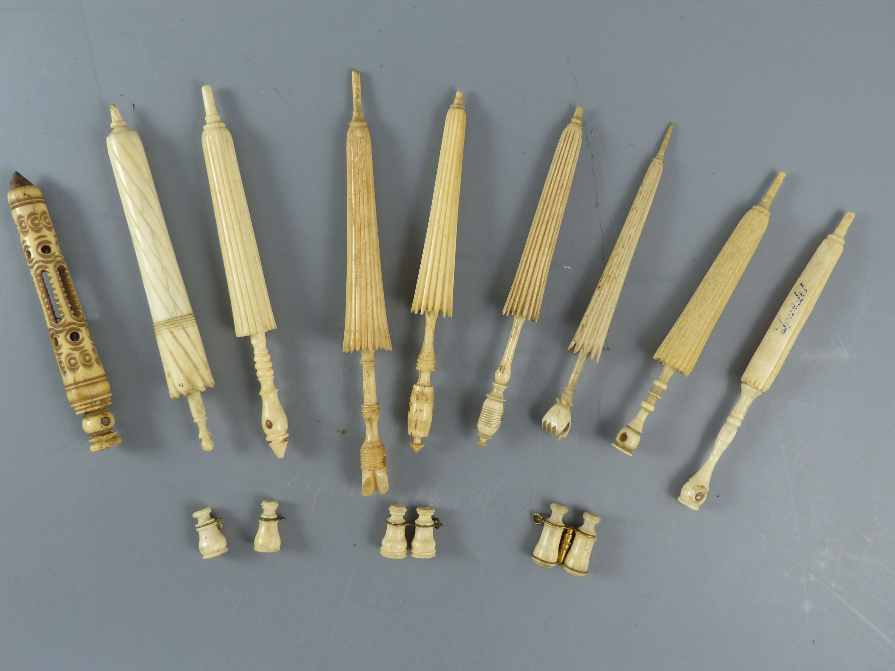 A collection of 19th century turned ivory and bone needle cases